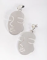 Silver Cutout Face Clip Earrings