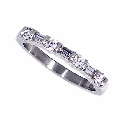 Platinum emerald cut and round diamond ring