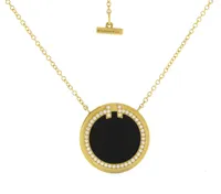 Tiffany T Diamond and Black Onyx Circle Pendant