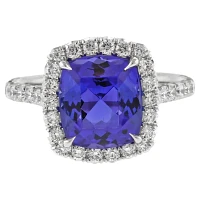 Tanzanite and Diamond Halo Ring by Pampillonia