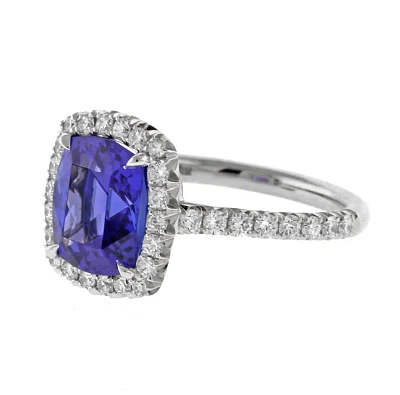 Tanzanite and Diamond Halo Ring by Pampillonia