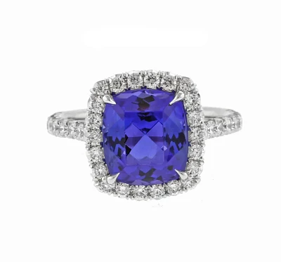 Tanzanite and Diamond Halo Ring by Pampillonia