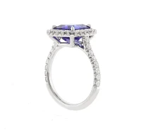 Tanzanite and Diamond Halo Ring by Pampillonia