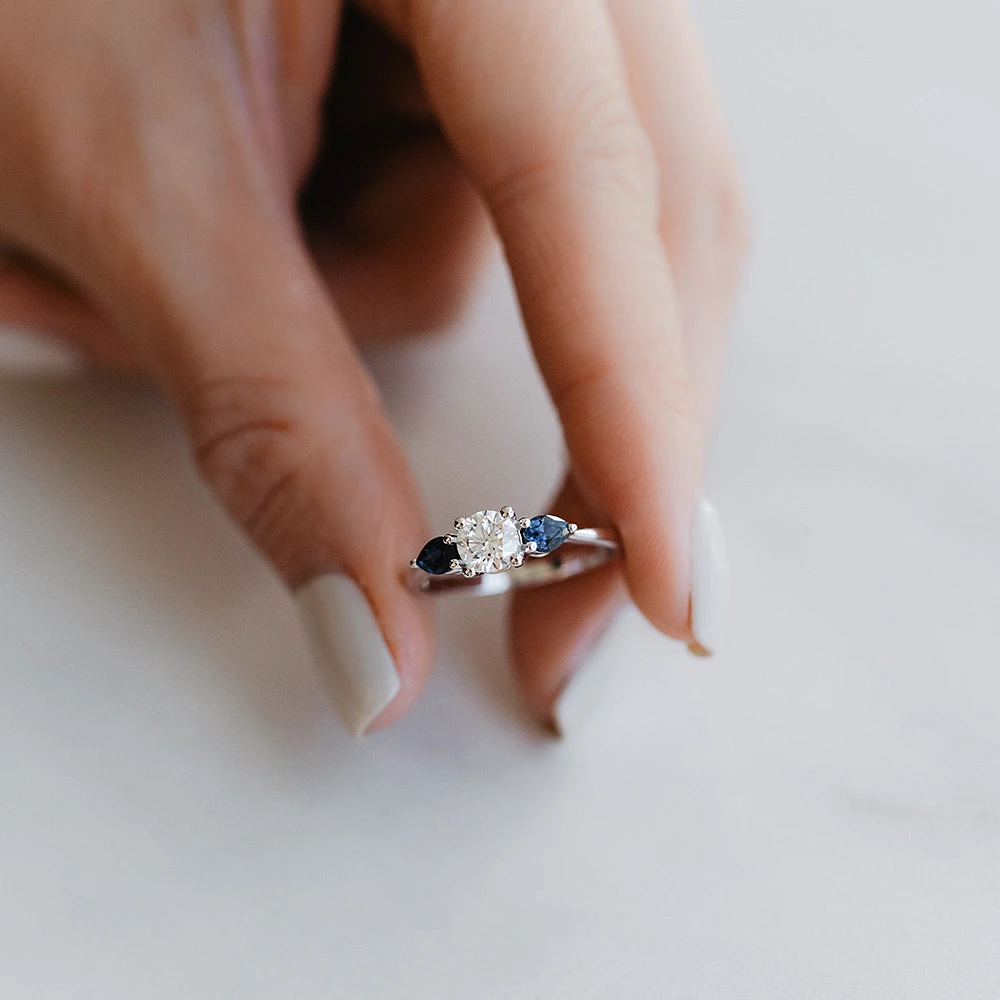 Colourless Collection Engagement Ring with Blue Sapphire and .50 Carat TW of Diamonds 18kt White Gold