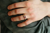 Ring with Garnet and .10 Carat TW of Diamonds 10kt White Yellow Gold