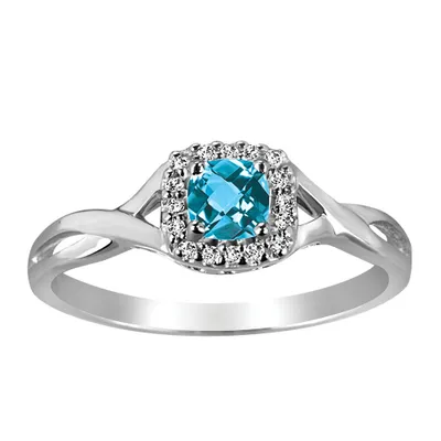 Ring with Blue Topaz and .08 Carat TW of Diamonds in 10kt White Gold