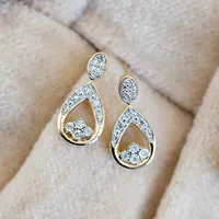Earrings with .10 Carat TW of Diamonds in 10kt Yellow Gold