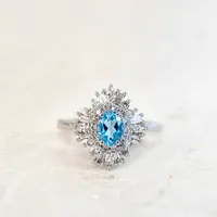 Ring with Blue Topaz and .53 Carat TW of Diamonds in 14kt White Gold