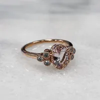 Ring with 8X6MM Oval Morganite and .15 Carat TW of Diamonds 14kt Rose Gold