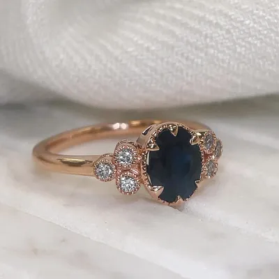 Ring with 8X6MM Oval Sapphire and .15 Carat TW of Diamonds in 14kt Rose Gold