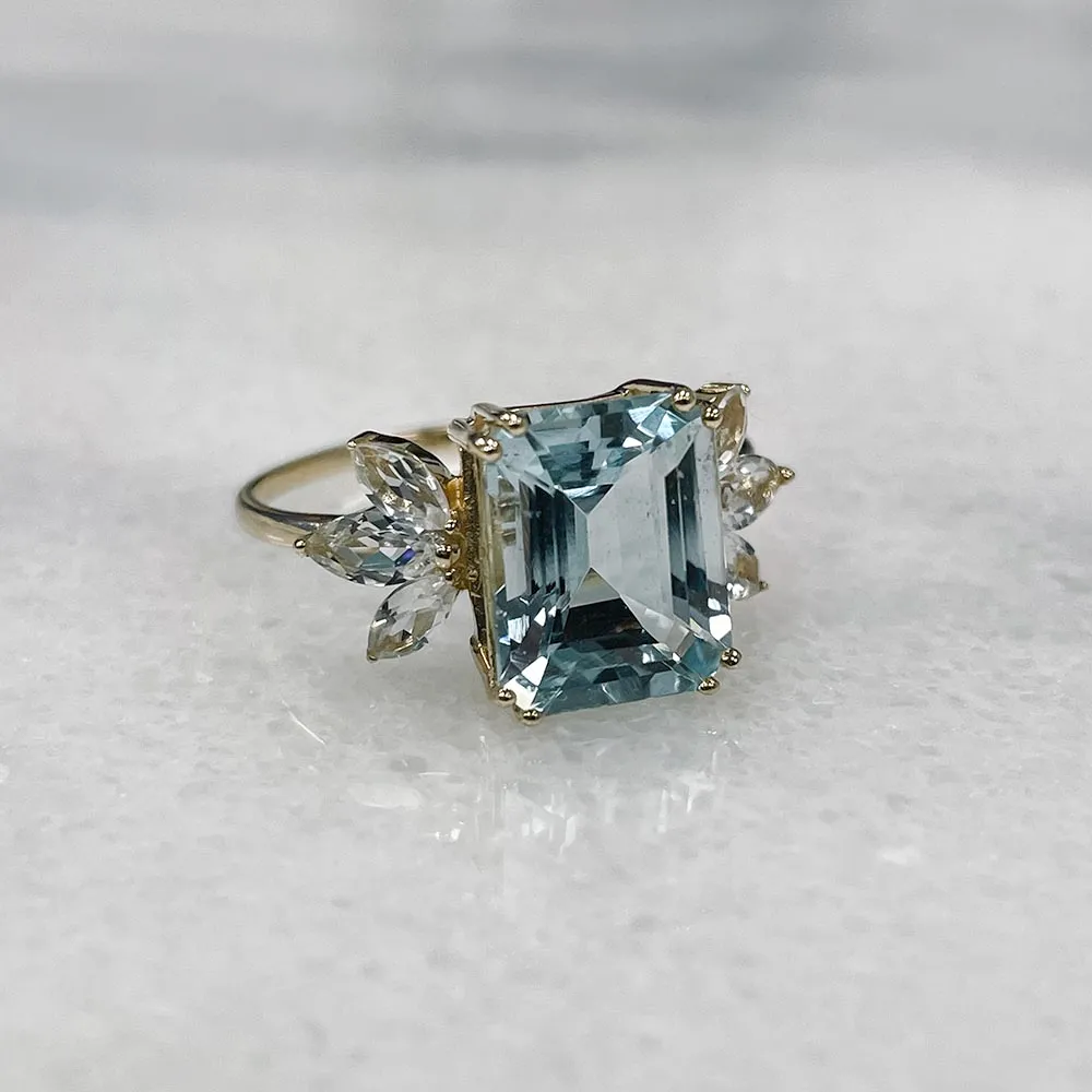 Ring with 10X8MM Emerald Cut Aquamarine and White Topaz in 14kt Yellow Gold