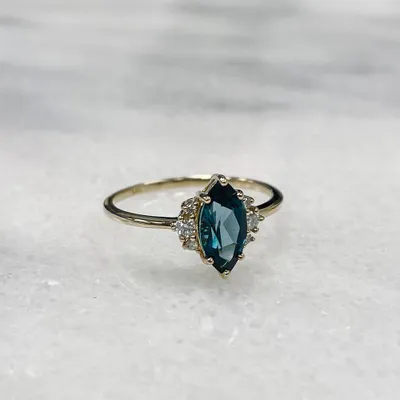 Ring with 10X5MM Marquise London Blue Topaz and .10 Carat TW of Diamonds in 14kt Yellow Gold