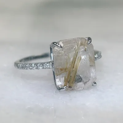 Ring With 11X9MM Emerald Cut Rutilated Quartz and .10 Carat TW of Diamonds in 14kt White Gold