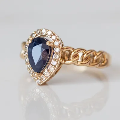 Ring with 7X5MM Pear Shape Blue Sapphire and .16 Carat TW of Diamonds 10kt Yellow Gold