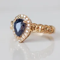 Ring with 7X5MM Pear Shape Blue Sapphire and .16 Carat TW of Diamonds 10kt Yellow Gold