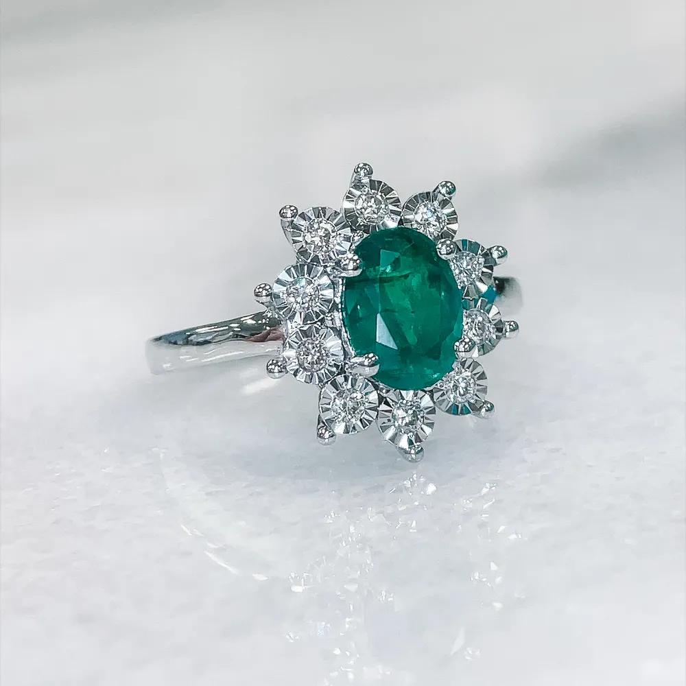 Ring with 8X6MM Oval Emerald and .18 Carat TW of Diamonds 14kt White Gold