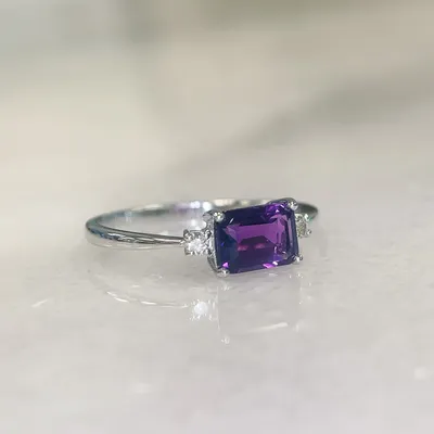 Ring with 5X7MM Emerald Cut Amethyst and .07 Carat TW of Diamonds in 10kt White Gold