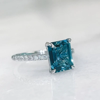 Ring with 8X6MM Emerald Cut London Blue Topaz and .20 Carat TW of Diamonds in 14kt White Gold