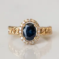 Ring with 8X6MM Oval Blue Sapphire and .16 Carat TW of Diamonds in 10kt Yellow Gold