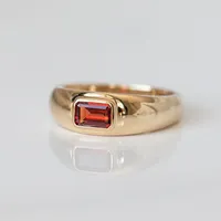 Ring with 5.5X3.5MM Emerald Cut Garnet in 10kt Yellow Gold