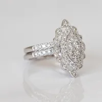 Halo Bridal Set With 1.00 Carat TW of Diamonds in 14kt White Gold