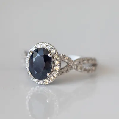 Ring with 8X6MM Oval Blue Sapphire and .50 Carat TW of Diamonds in 14kt White Gold