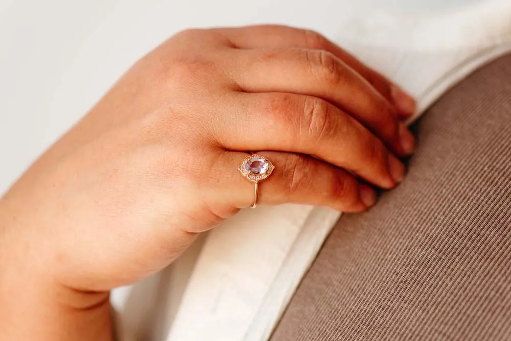 Ring with Oval Pink Amethyst and .08 Carat TW of Diamonds in 10kt Rose Gold