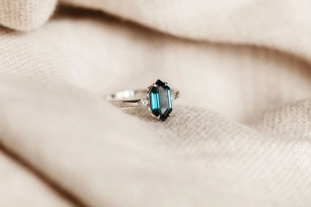 Ring with 10X5MM Hexagon London Blue Topaz and .06 Carat TW of Diamonds in 14kt White Gold