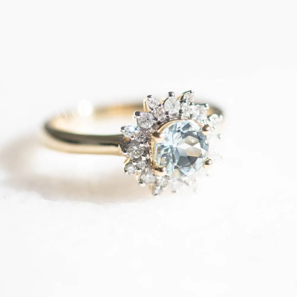 Ring with 6MM Round Aquamarine and .30 Carat TW of Diamonds in 14kt Yellow Gold