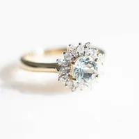 Ring with 6MM Round Aquamarine and .30 Carat TW of Diamonds in 14kt Yellow Gold