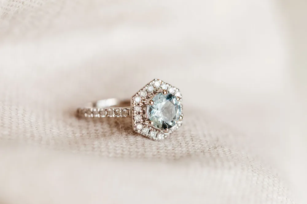 Ring with 7MM Round Aquamarine and .45 Carat TW of Diamonds 14kt White Gold