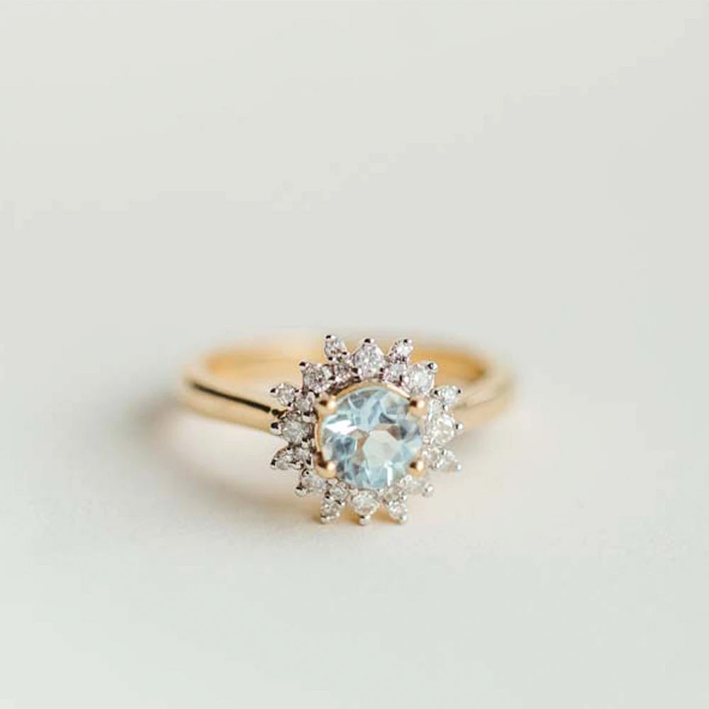 Ring with 6MM Round Aquamarine and .30 Carat TW of Diamonds in 14kt Yellow Gold