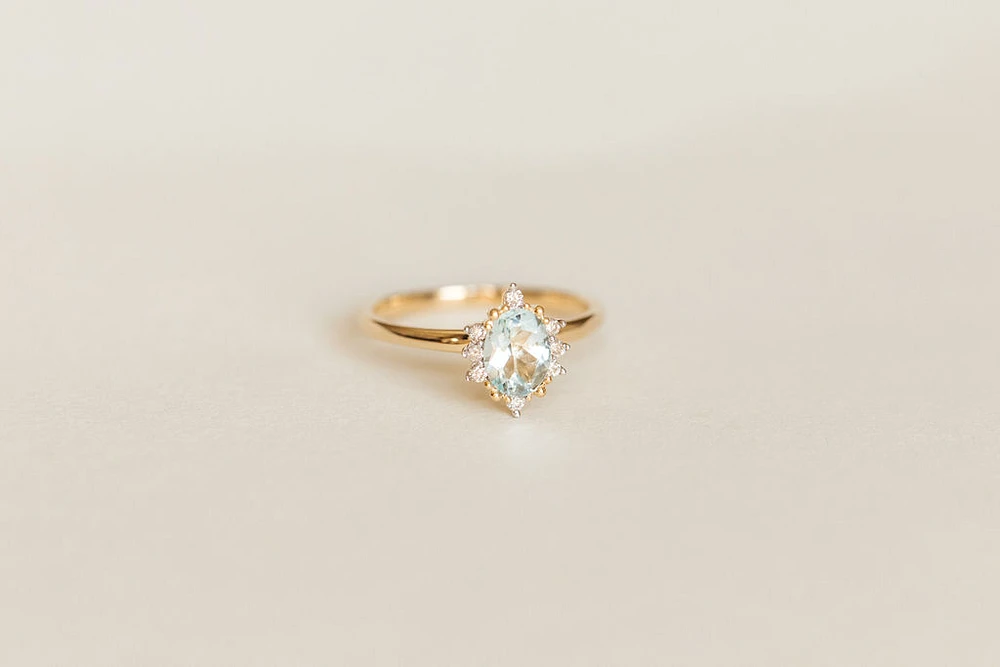 Ring with 7X5MM Oval Aquamarine and .08 Carat TW of Diamonds in 14kt Yellow Gold