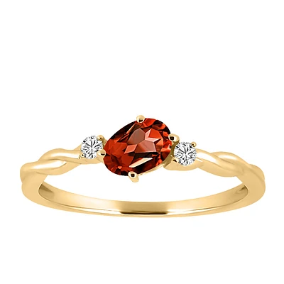 Ring with 4X6MM Oval Garnet and .06 Carat TW of Diamonds 10kt Yellow Gold