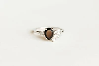 Ring with 8X6MM Pear Shape Black Onyx and White Topaz in 14kt White Gold