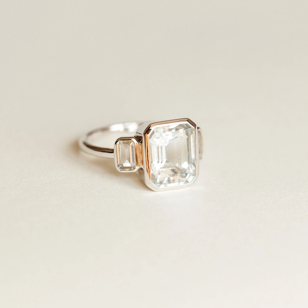 Ring with 10X8MM Emerald Cut Aquamarine and White Topaz in 10kt White Gold