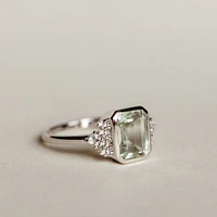 Ring with 10X7MM Octagonal Emerald Cut Green Amethyst and White Topaz 10kt Gold