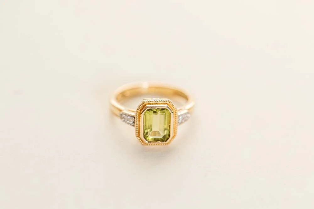 Ring with 7X5MM Octagonal Peridot and .05 Carat TW of Diamonds 14kt Yellow Gold