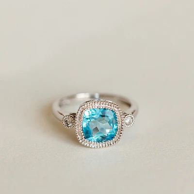 Ring with 8MM Blue Topaz and .07 Carat TW of Diamonds in 14kt White Gold