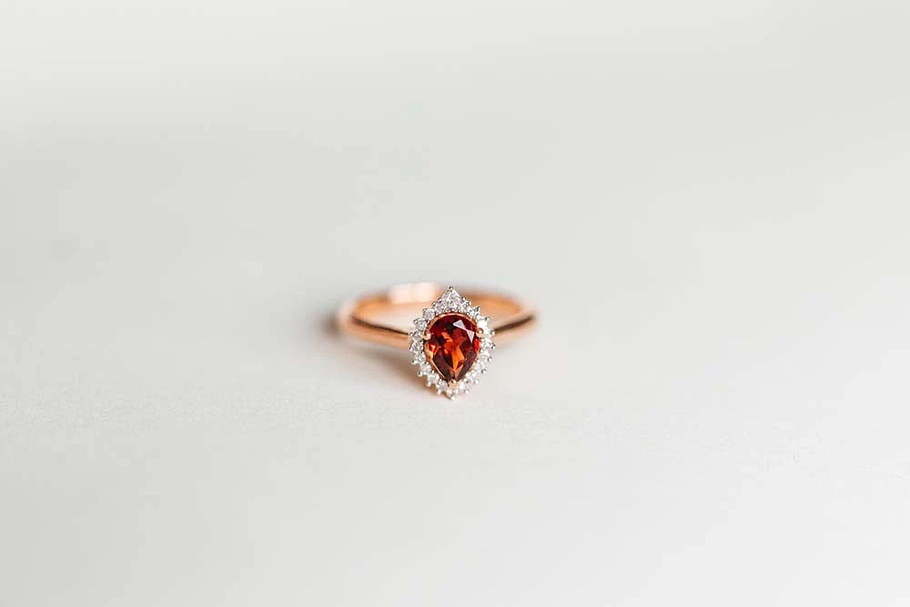 Ring with 7X5MM Pear Shape Garnet and .10 Carat TW of Diamonds in 14kt Rose Gold