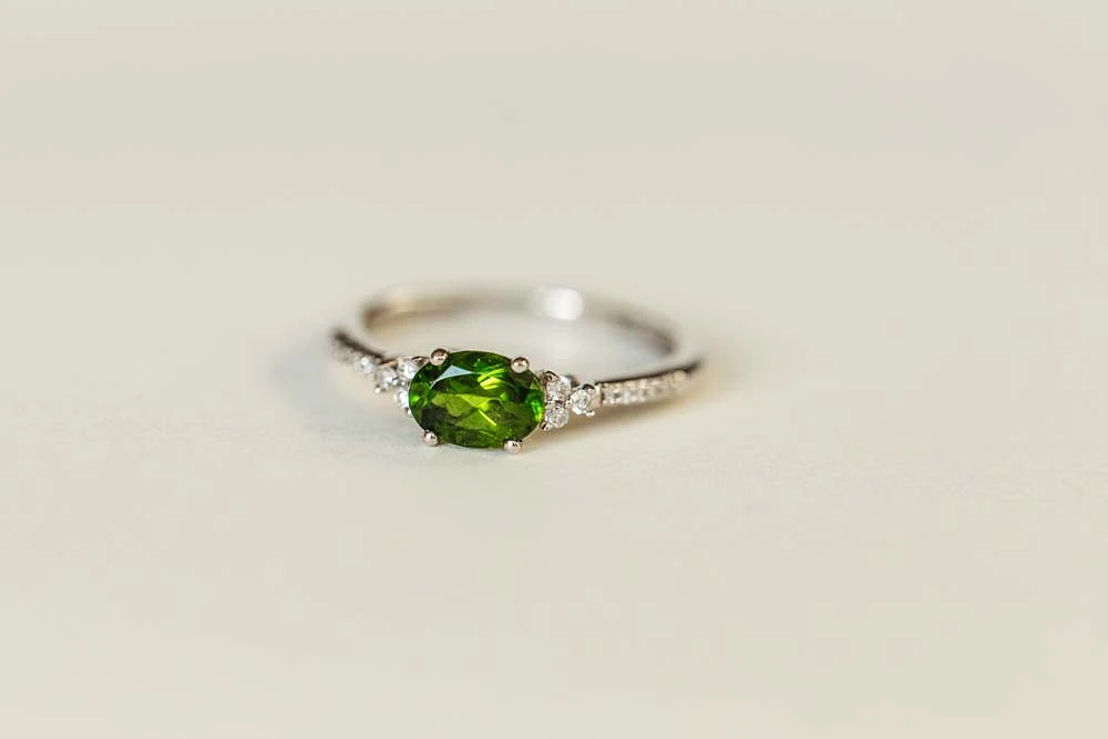 Ring with Oval 7X5MM Green Tourmaline and .10 Carat TW of Diamonds 14kt White Gold