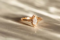 Halo Engagement Ring with .55 Carat TW of Diamonds in 14kt Rose Gold