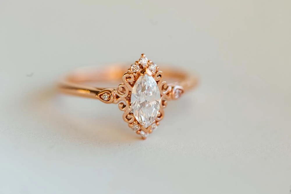 Halo Engagement Ring with .55 Carat TW of Diamonds in 14kt Rose Gold