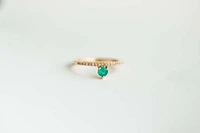 Ring with 3.8MM Round Emerald and .12 Carat TW of Diamonds 14kt Yellow Gold