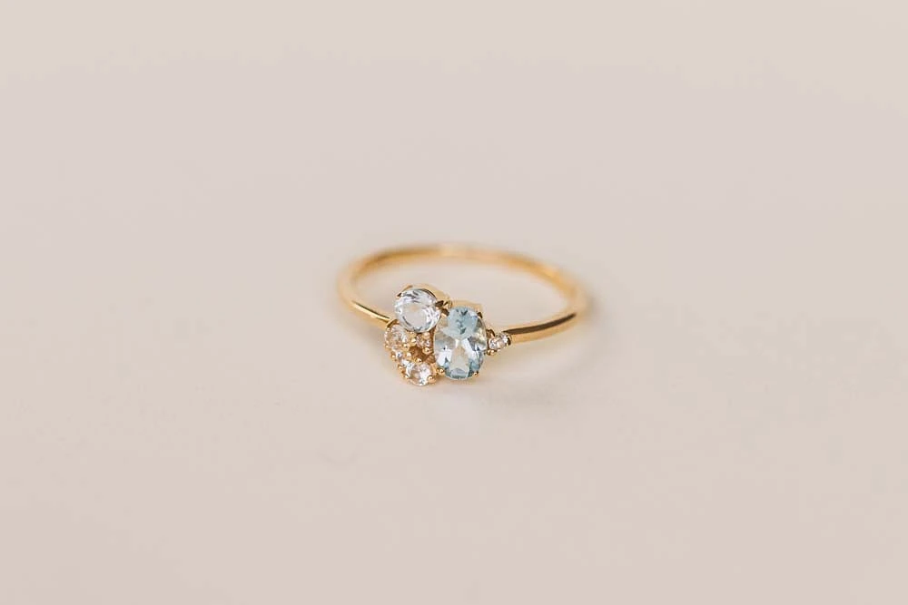 Ring with 6X4MM Oval Blue Topaz, Round Aquamarine and Blue Topaz in 10kt Yellow Gold