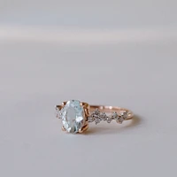 Ring with 8X6MM Oval Aquamarine and .25 Carat TW of Diamonds in 14kt Rose Gold