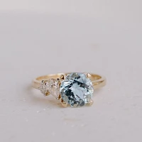 Ring with 8MM Round Aquamarine and .15 Carat TW of Diamonds 14kt Yellow Gold