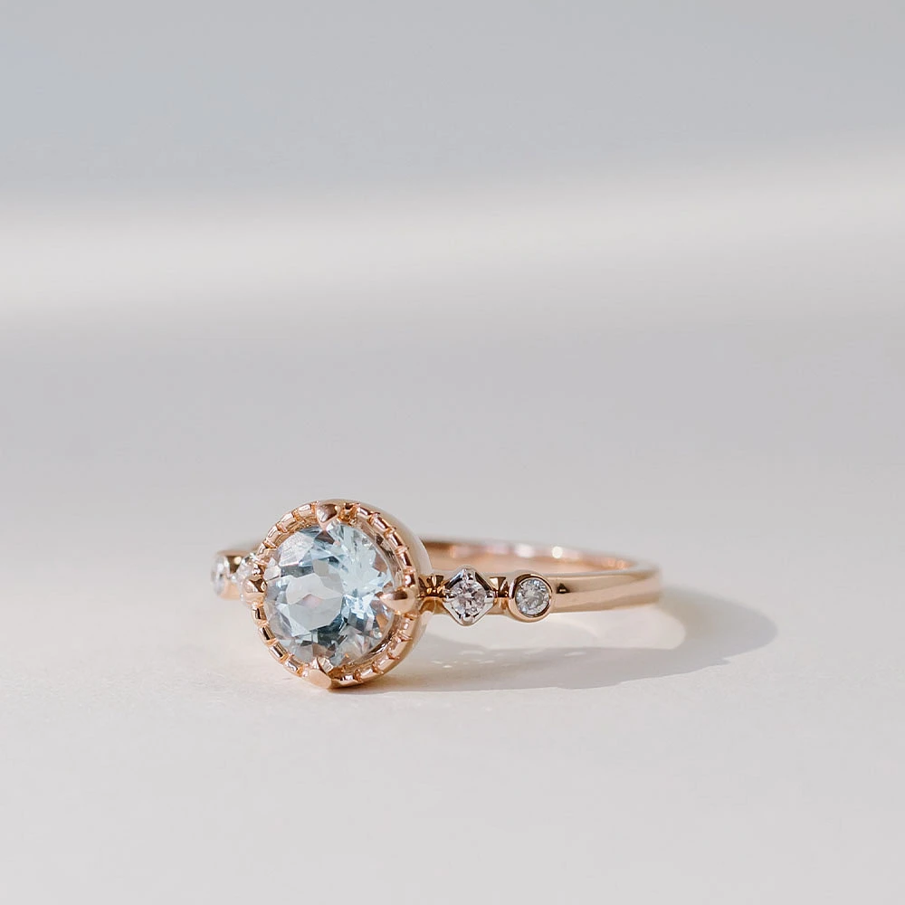 Ring with 6MM Round Aquamarine and .05 Carat TW of Diamonds 14kt Rose Gold