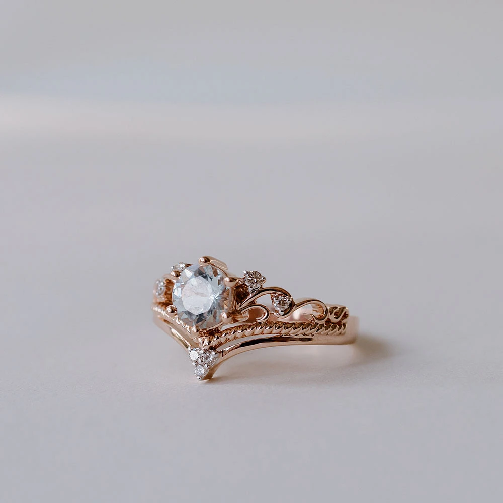 Ring with 6MM Round Aquamarine and .08 Carat TW of Diamonds in 14kt Rose Gold