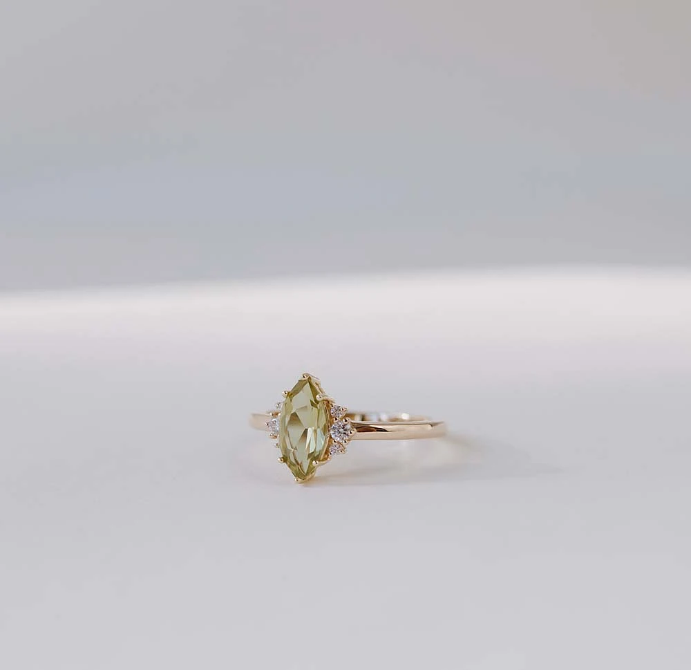 Ring with 9X5MM Marquise Olive Green Quartz and .10 Carat TW of Diamonds in 14kt Yellow Gold